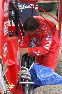 Hannagan works to ready a competitors machine before the final NRA event of 2012 at Eldora Speedway