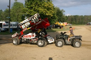 Gregg Dalman gets a push from Keegan through the pits at Crystal Motor Speedway.